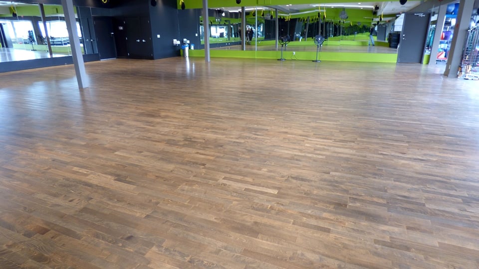 Wood flooring laid across a commercial space during installation