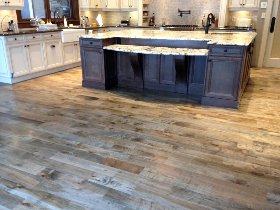 Reclaimed wide-plank hardwood flooring with visible natural grain