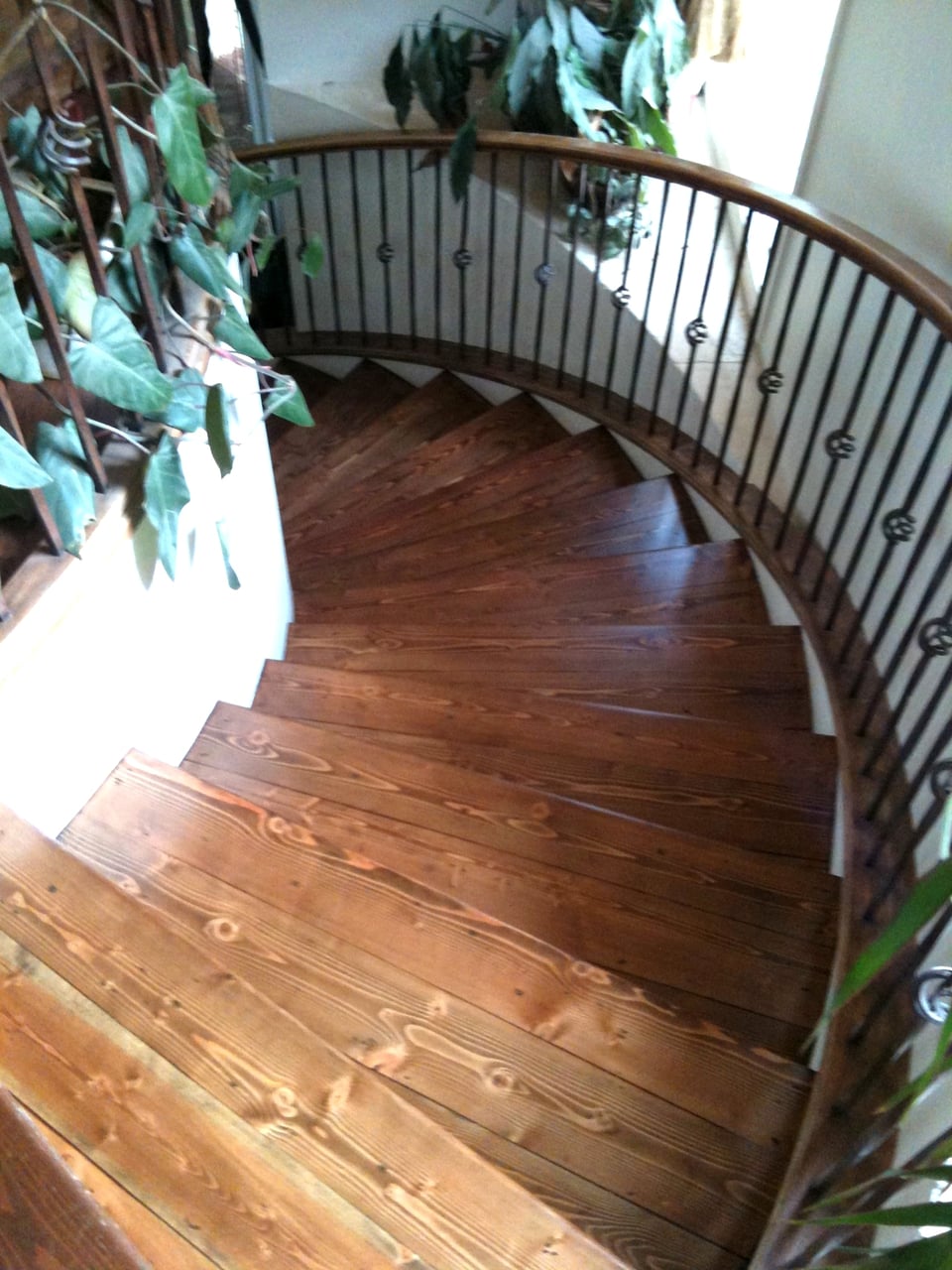 Hardwood staircase installed between finished floor levels